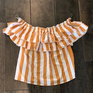 A. Calen by flying tomato off the shoulder top